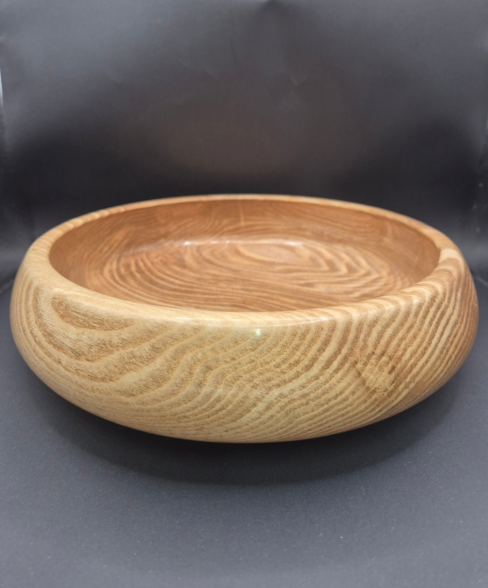 Donegal beeswax finish highlighting natural wood grain on olive ash bowl